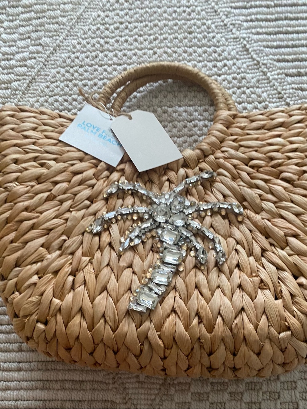 Straw bag with silver gems in a shape of a palm tree